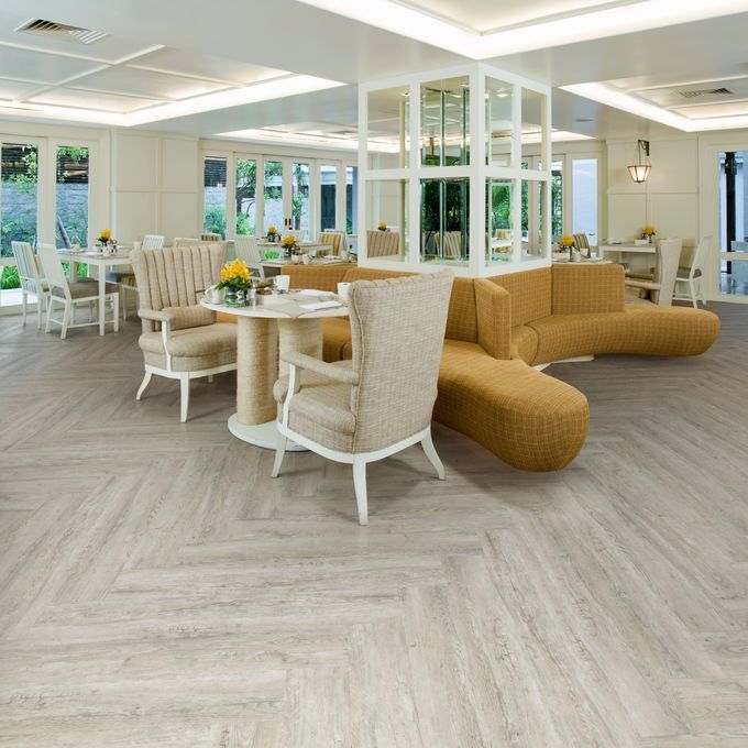 Dining area with full plank herringbone design rustic effect flooring