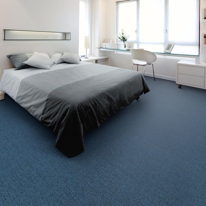 Polyflor Expona Fabrik in Dark Blue laid in a bedroom