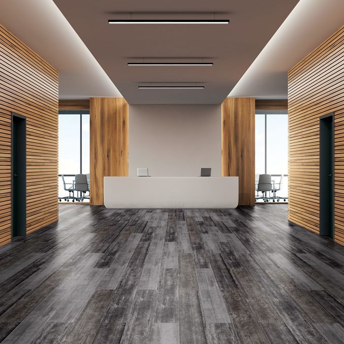 Large commercial office corridor with black abstract style flooring