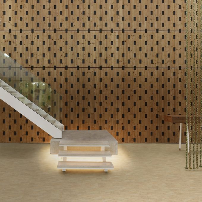 Staircase with glass banister featuing a light stone effect flooring 