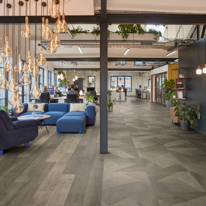 Oak effect flooring straight laid and prism style in a modern commercial office