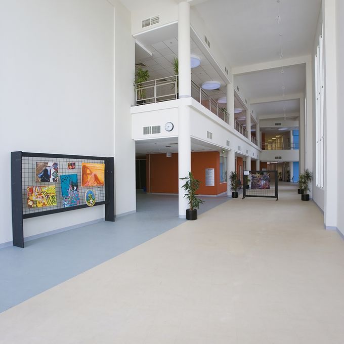 Higher education corridor with pupil art on the wall