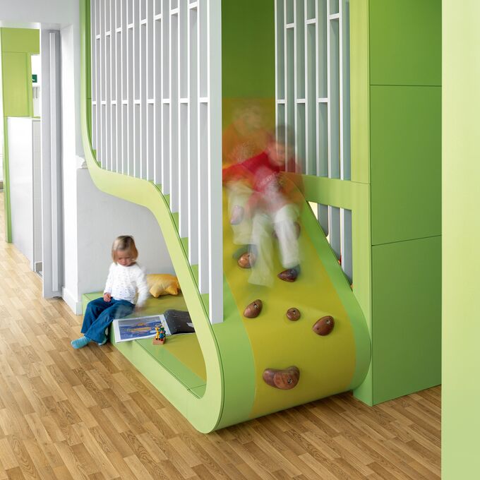 Oak effect flooring lid in a corridor with children playing