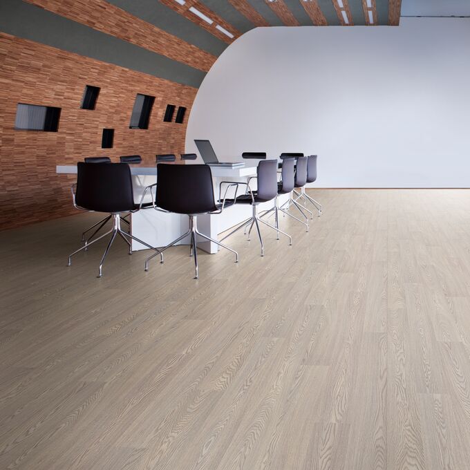 Oak effect flooring laid in a large office meeting area