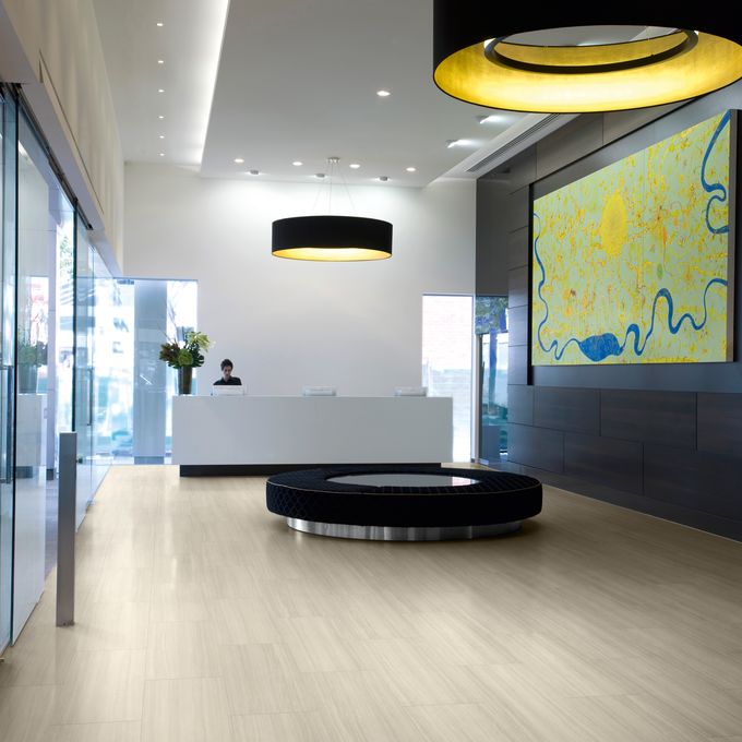 Light wood effect flooring in a modern reception area