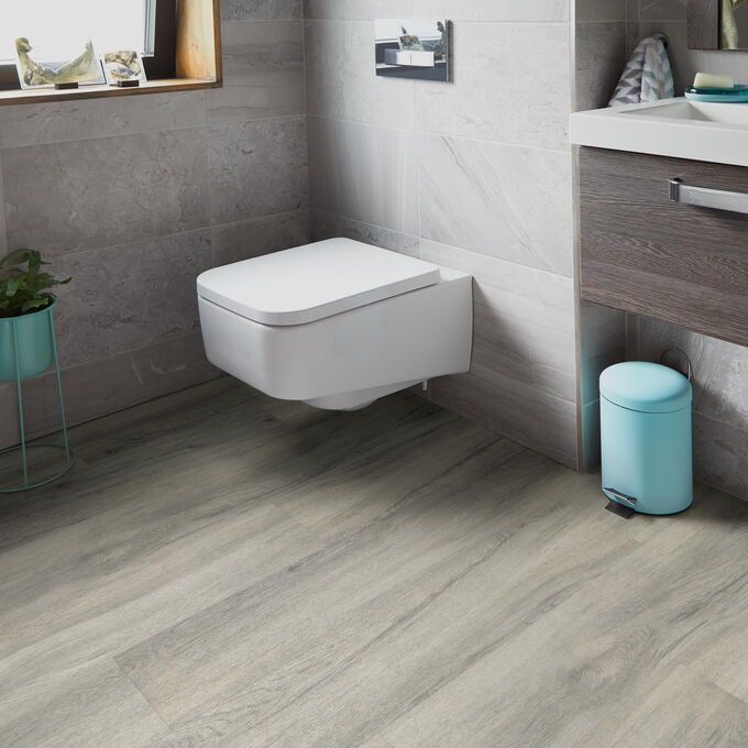 TLC Original in Kensington Oak laid in a bathroom