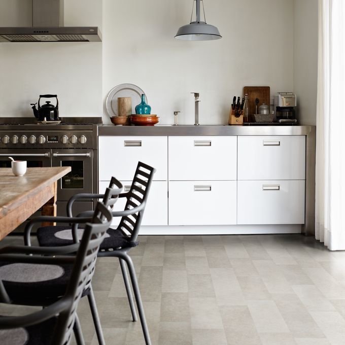Light grey limestone effect flooring in a family kitchen 