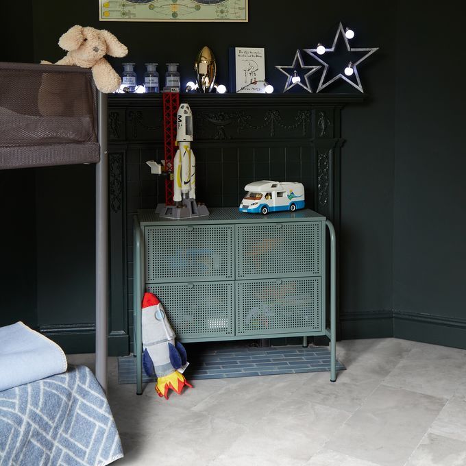 Grey coloured slate effect flooring in a childs bedroom with black walls