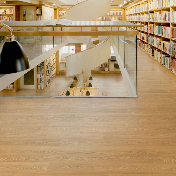 Large library hallway with oak effect flooring