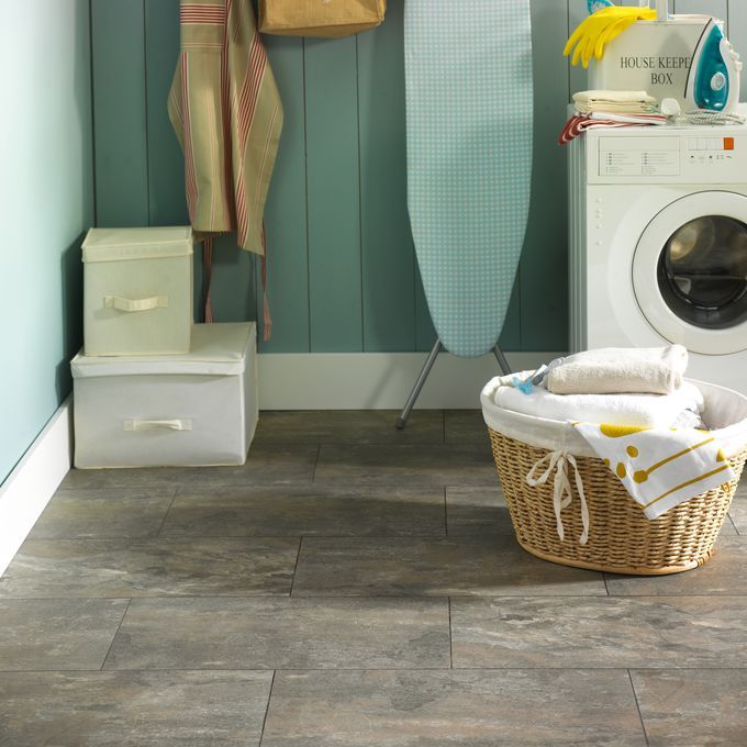 Laundry room featuring slate effect flooring laid in a brickwork design in Ocean Slate using a Graphite Grouting Strip. . 