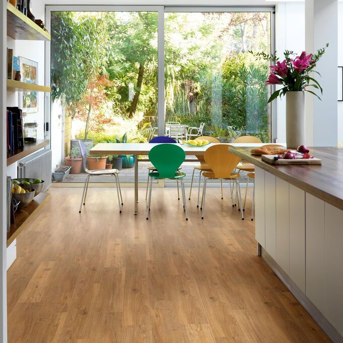 TLC Original in Cambridge Oak laid in a kitchen/dining room