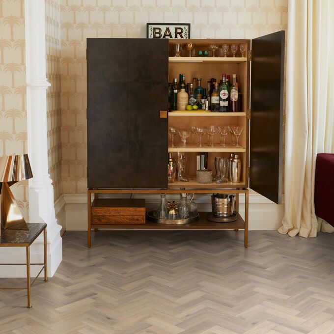 TLC Massimo in Blond Oak Small Parquet laid in a living room alongside a liquor cabinet