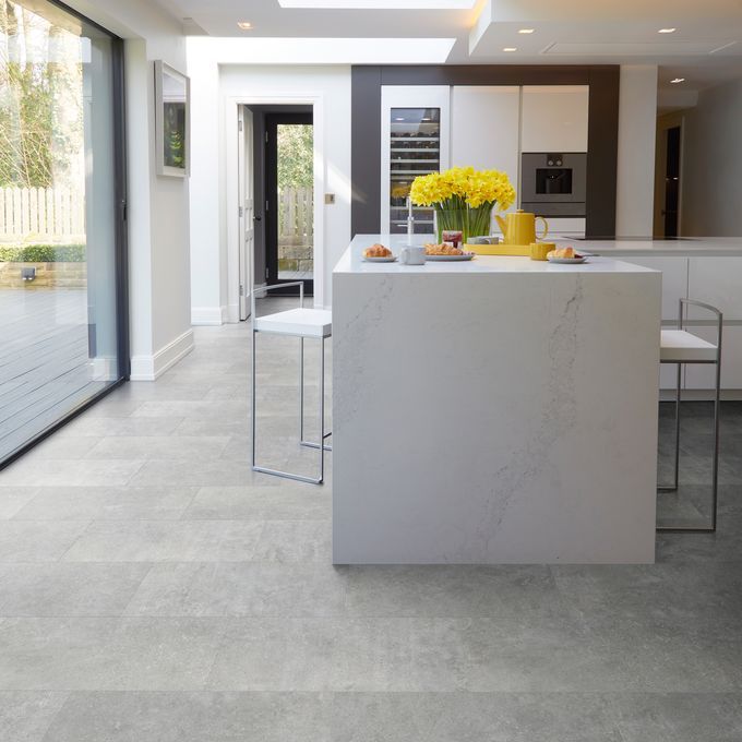 Cement effect flooring laid in a open modern kitchen