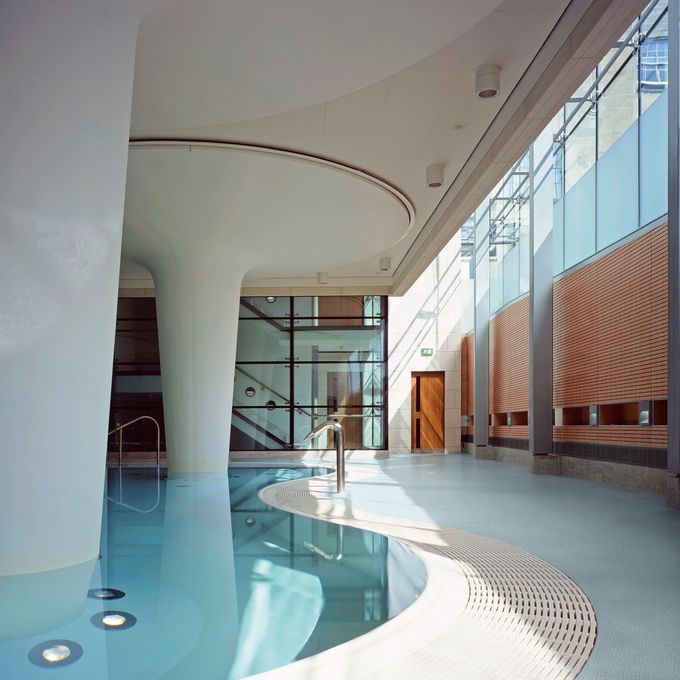 Swimming pool area awith light blue walkways