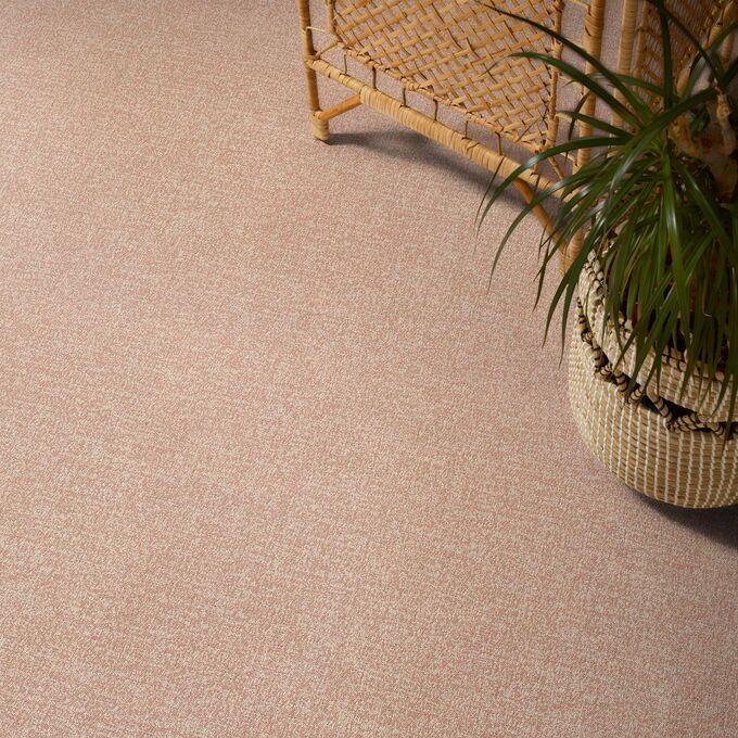 Polyflor Expona Fabrik in Dust Pink next to a potted plant 