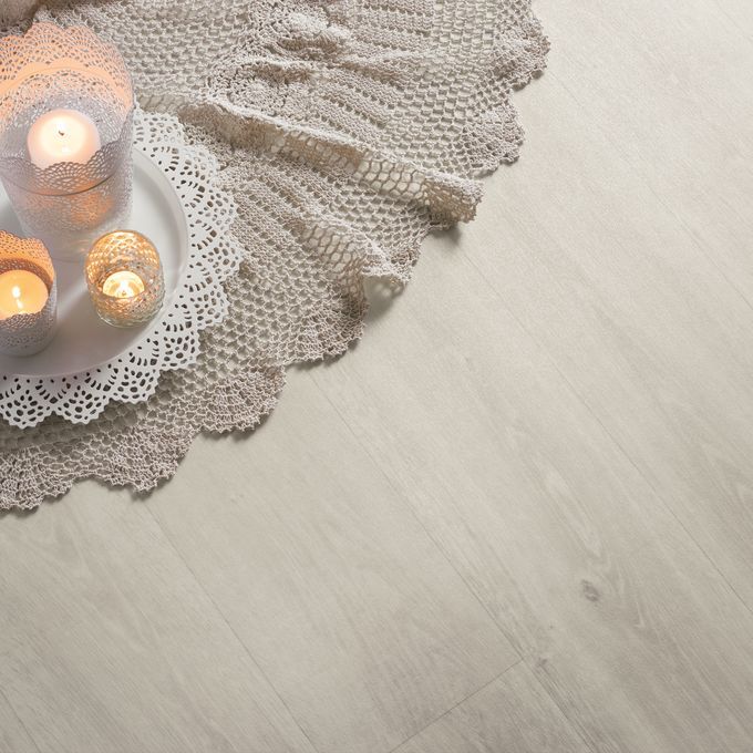 Arrangement of candles featuring a white oak wood effect floor