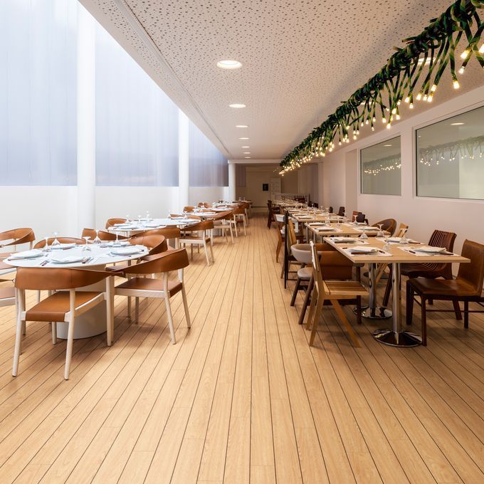 Dining area in a restaurant with wood effect flooring 