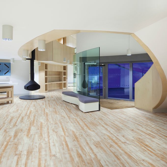 Modern open space with seating and light wood effect flooring 