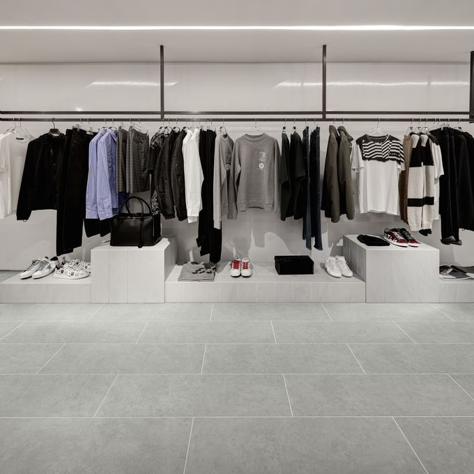 Clothing store with grey stone effect flooring