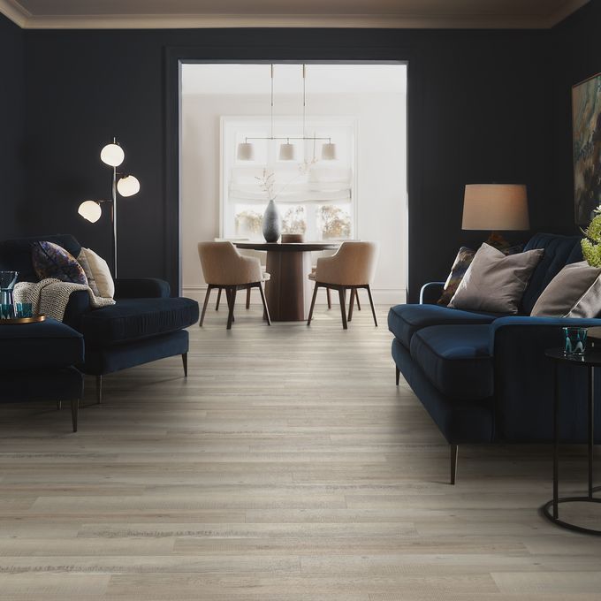 Living room with dark walls and neutral oak flooring