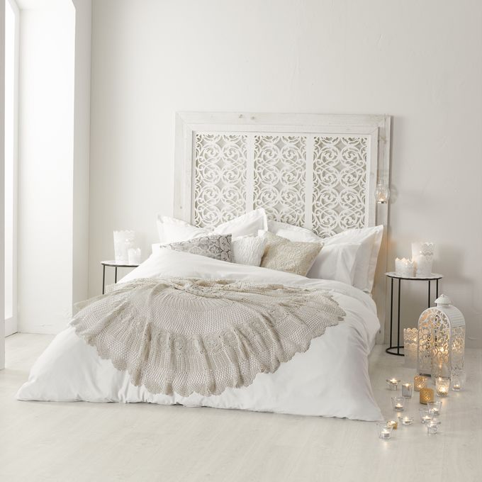 Chalk white oak flooring in a bedroom with a large white bed