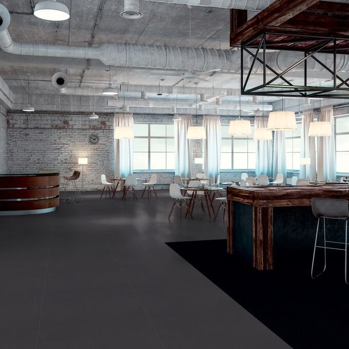 Dark coloured flooring laid in a bar/ restaurant area