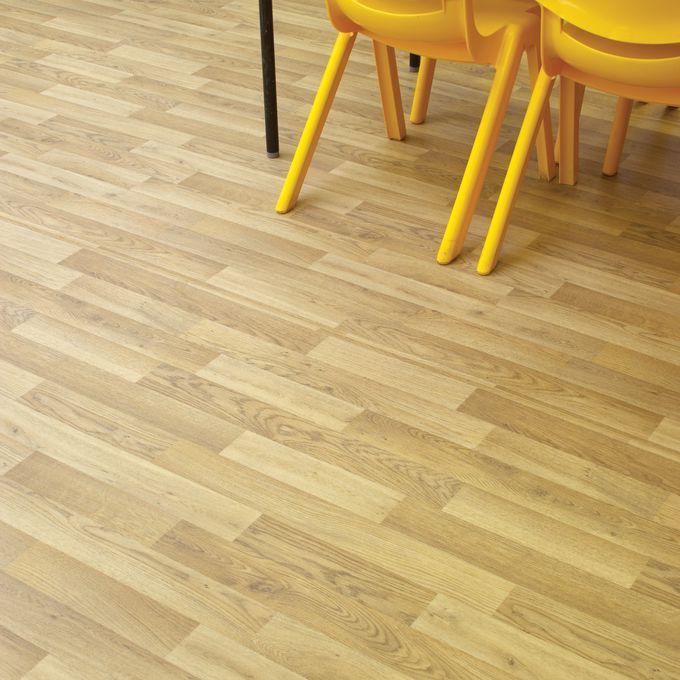 Close up of school dining hall oak effect flooring