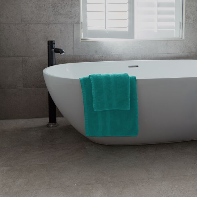 Bathroom, bathtub, towels, modern, concrete effect flooring 