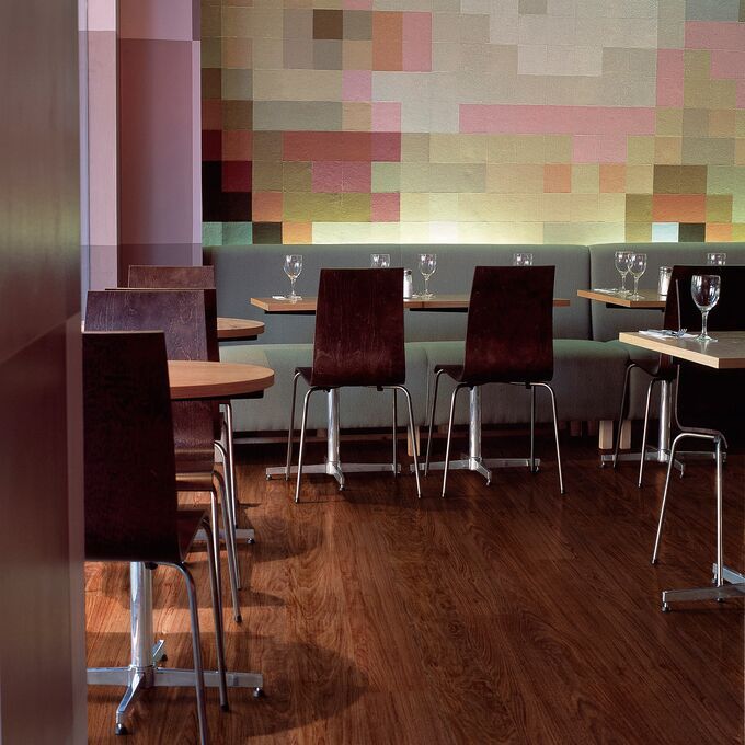 Dark walnut effect flooring in a restaurant dining area