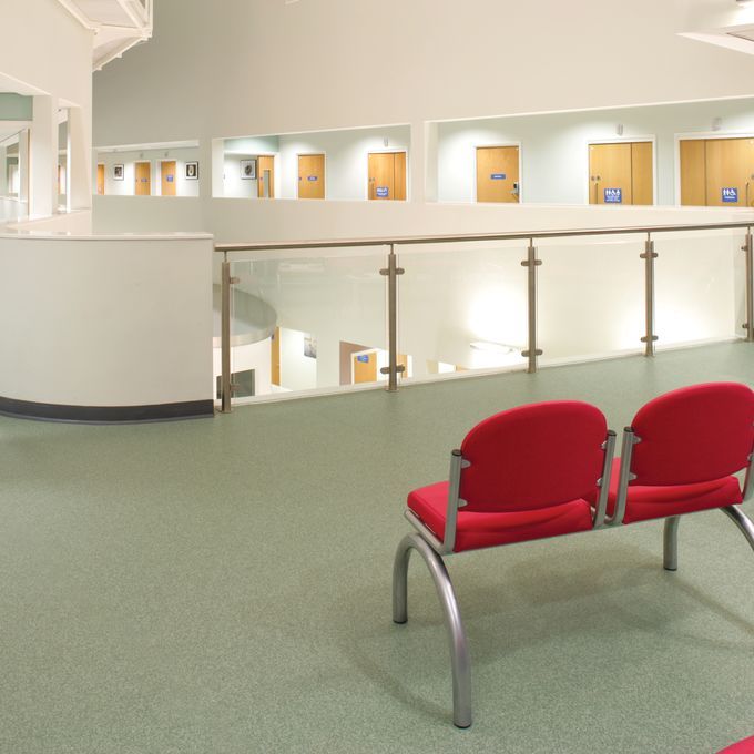 Green flooring in a large waiting area