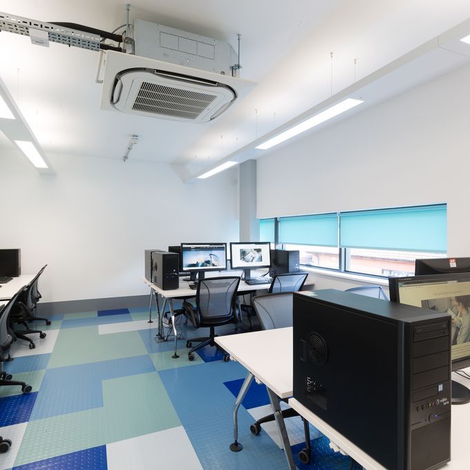 Classroom with computers and mixed coloured flooring