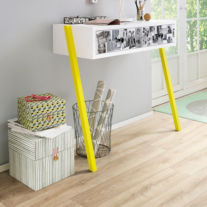 Light oak wood effect flooring and a side console table and accessories 