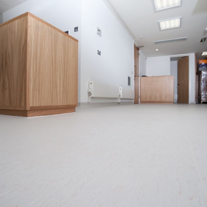 Large open corridor with light coloured flooring